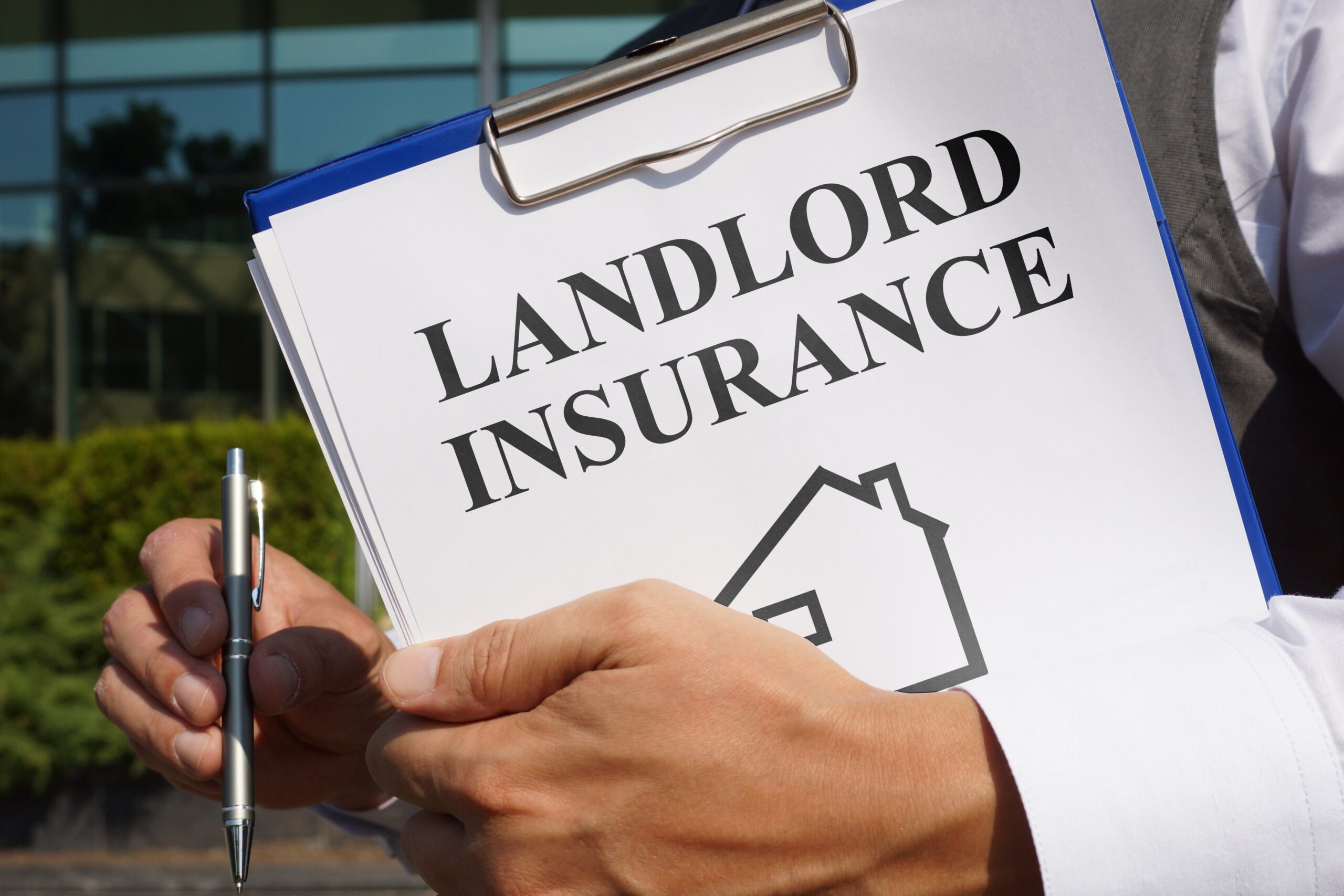 A piece of paper with 'landlord insurance' written ontop