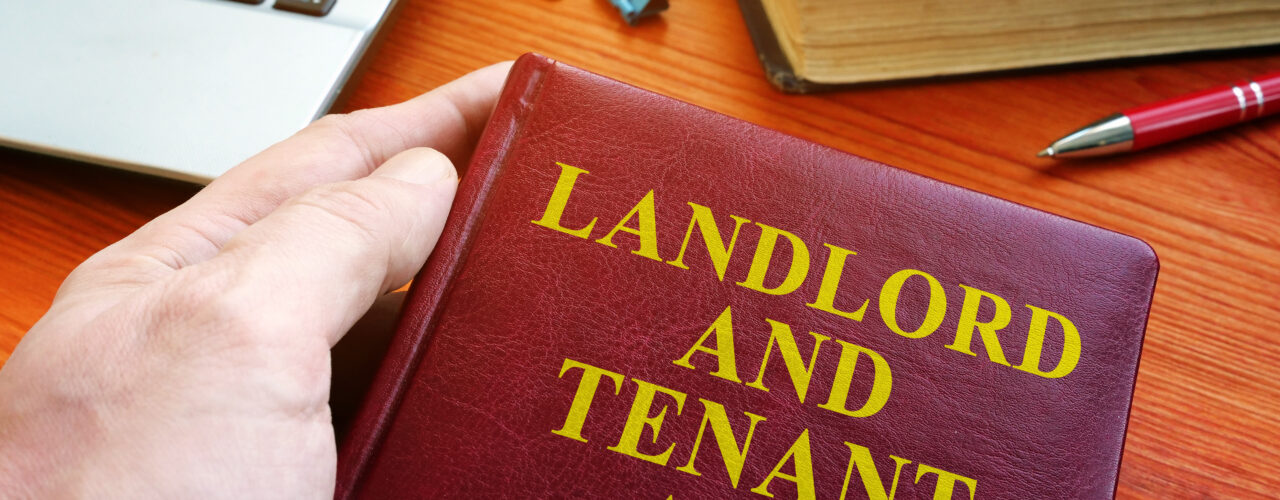 A birds-eye-view of a book that says 'landlord and tenant act'.