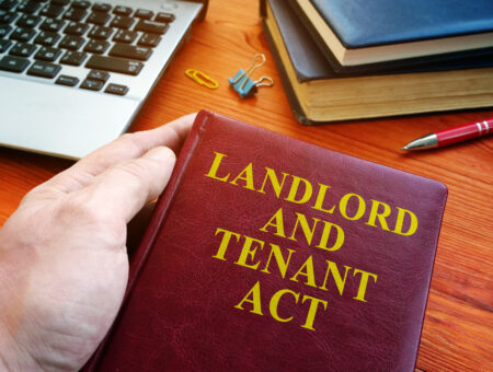 A birds-eye-view of a book that says 'landlord and tenant act'.