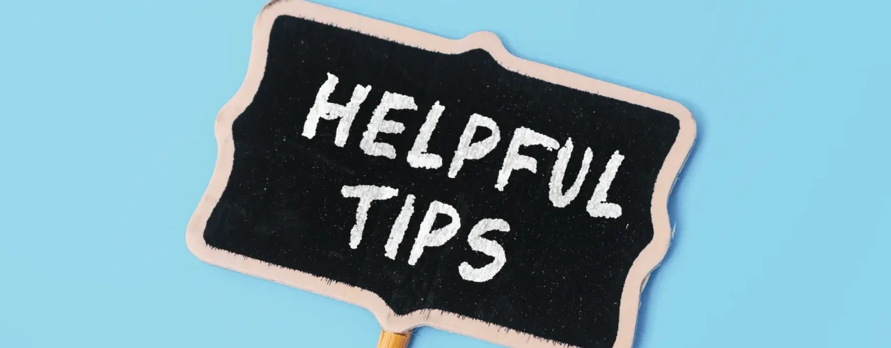 A chalk board sign with the words "helpful tips" on
