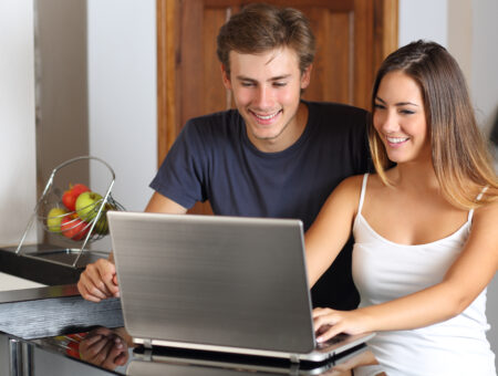 An image of a couple connecting to the broadband in a rented property.