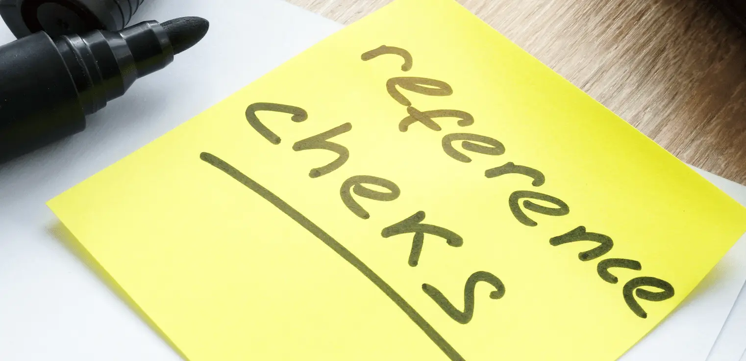 Yellow sticky note with "Reference check" in black ink