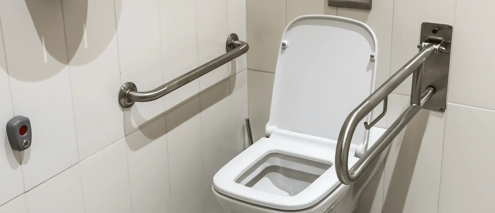 A toilet with handrail modifications for a disabled tenant