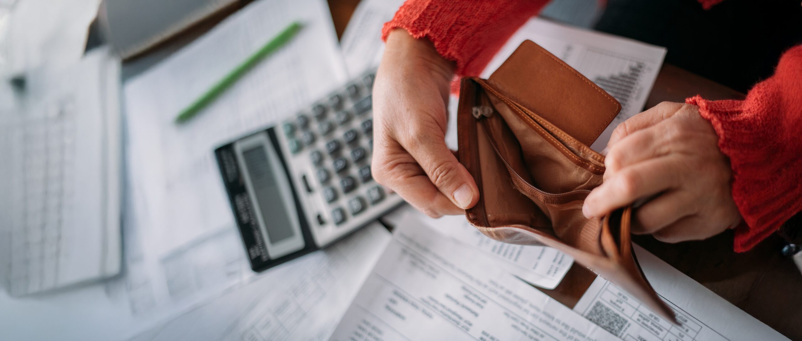 A person looking in their wallet