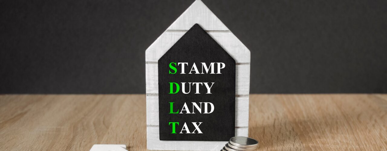 A model shaped as a house with 'Stamp duty land tax'