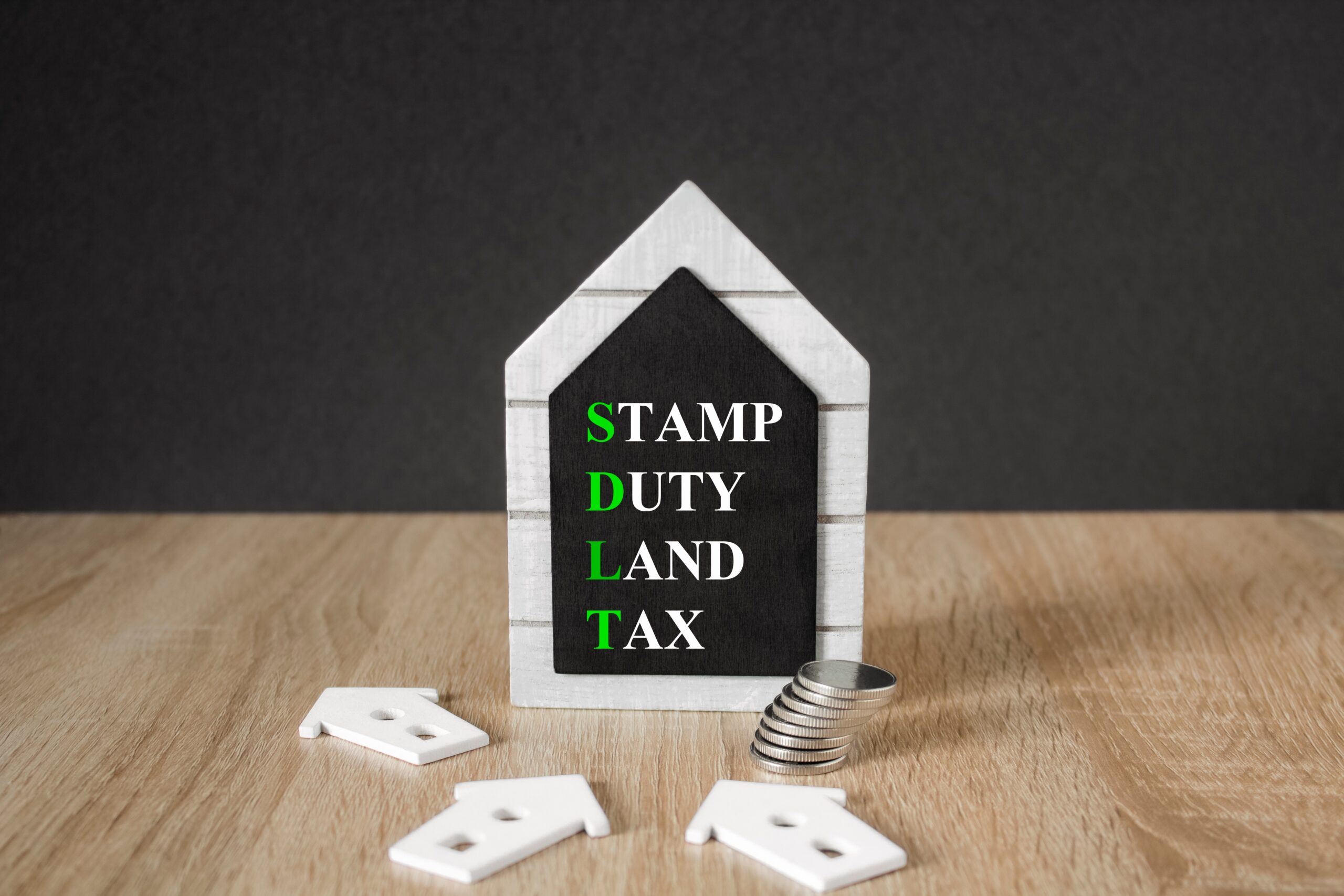 A model shaped as a house with 'Stamp duty land tax'