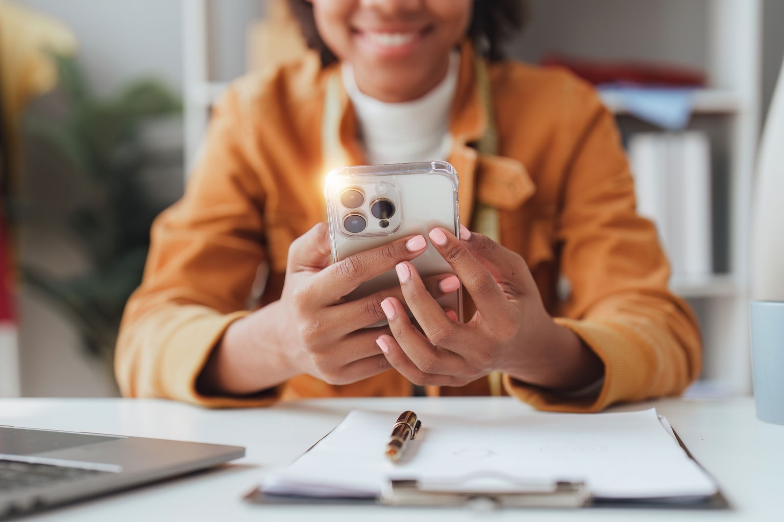 A woman using her phone for open banking