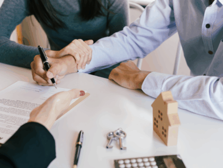 A landlord signing the forms to change letting agents.