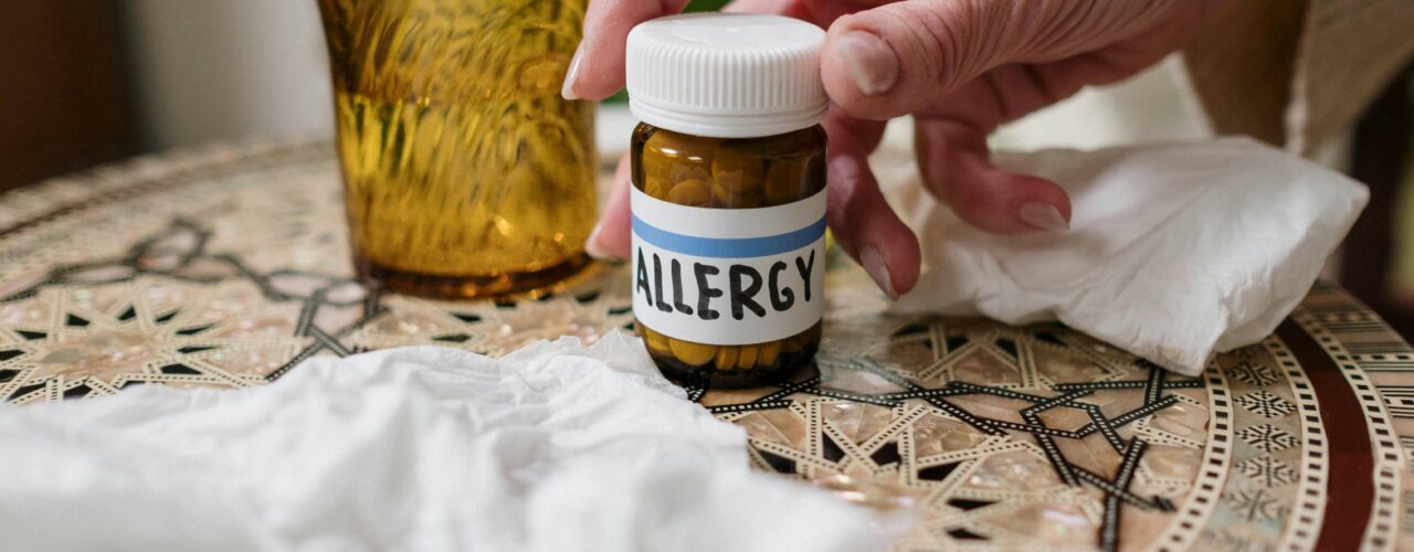 An image of a bottle with the label 'allergy' on it